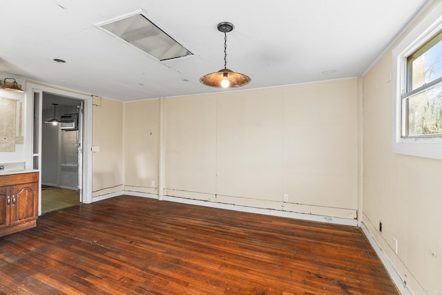 unfurnished room with dark wood-type flooring