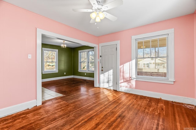 entryway with a wealth of natural light, hardwood / wood-style floors, and ceiling fan