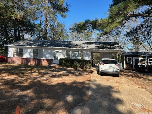 ranch-style home featuring a carport