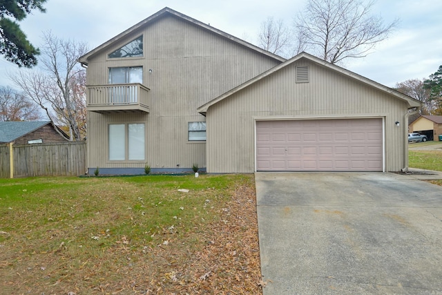 exterior space featuring a garage, a balcony, and a front lawn