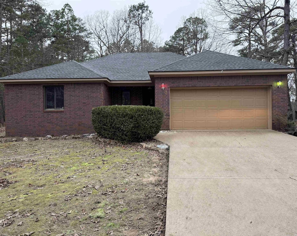 ranch-style home featuring a garage