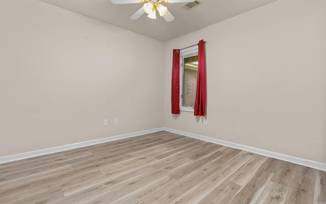 empty room with light hardwood / wood-style floors and ceiling fan