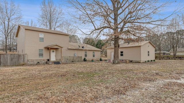 view of front of property featuring fence