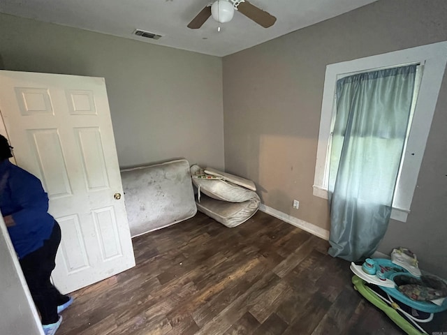 bedroom featuring ceiling fan and dark hardwood / wood-style flooring