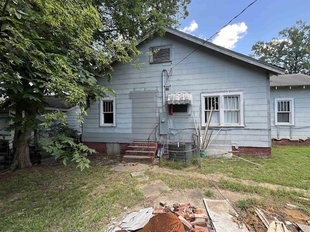 back of house with a yard