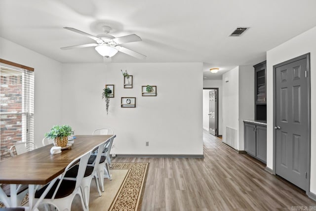 unfurnished dining area featuring ceiling fan and light hardwood / wood-style flooring