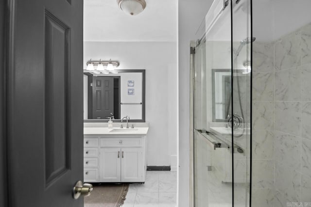 bathroom with vanity and an enclosed shower