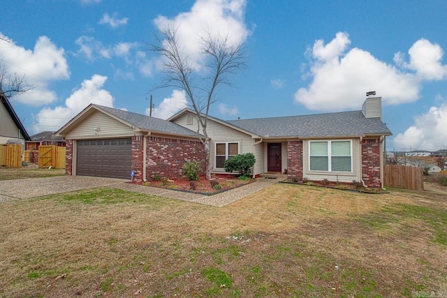 ranch-style house with a garage and a front lawn