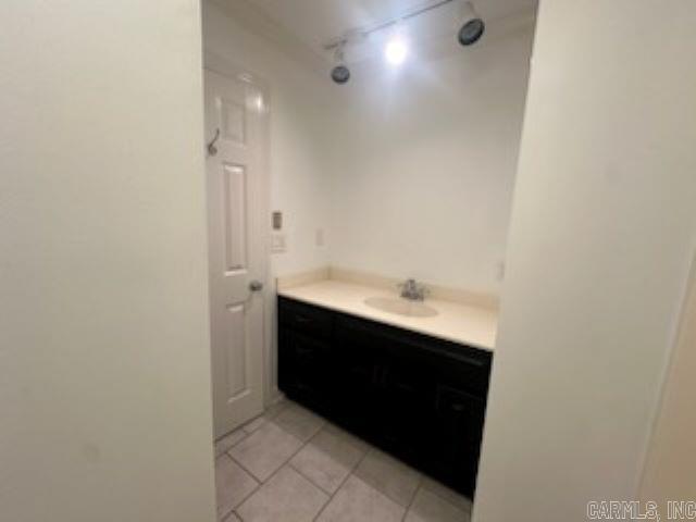 bathroom with tile patterned flooring and vanity