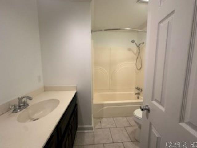 full bathroom featuring tile patterned flooring, vanity, shower / bath combination, and toilet