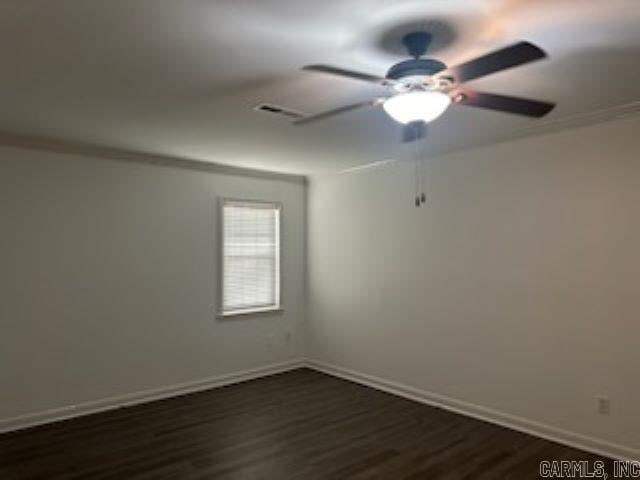 empty room featuring dark hardwood / wood-style floors and ceiling fan