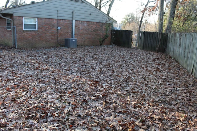 view of yard with central AC unit