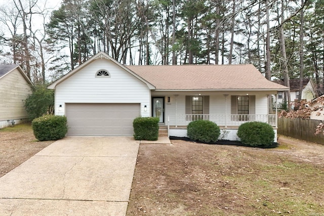 ranch-style house featuring a porch and a garage