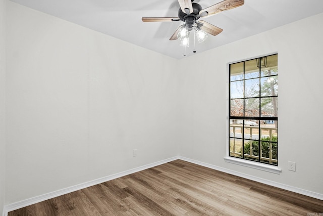 empty room featuring light wood-type flooring and ceiling fan