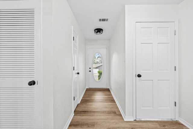 entryway with light hardwood / wood-style flooring