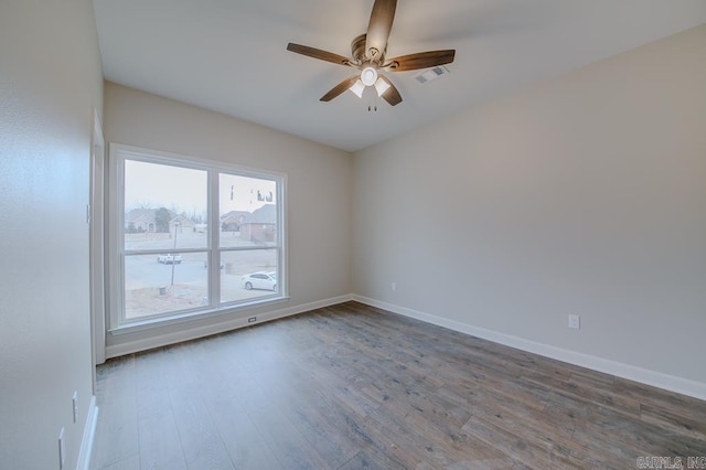 empty room with wood-type flooring and ceiling fan