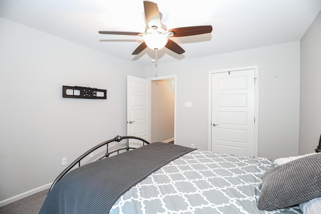 bedroom with ceiling fan, a closet, and carpet floors