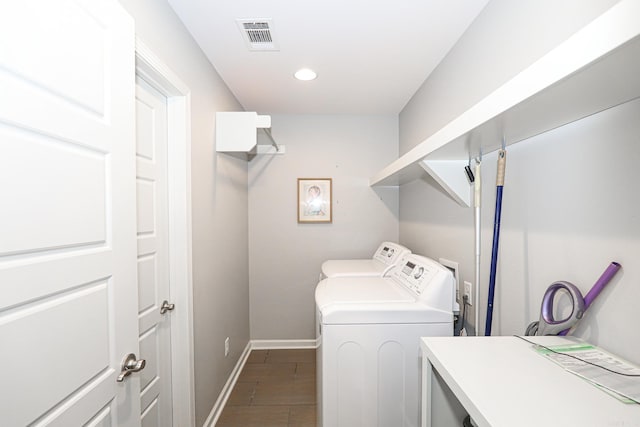 clothes washing area featuring washer and clothes dryer