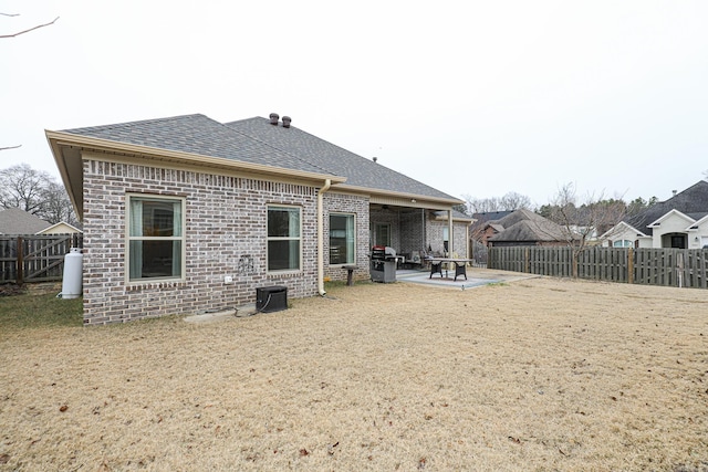 back of property featuring a patio