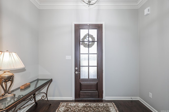 foyer entrance with dark wood-type flooring and ornamental molding