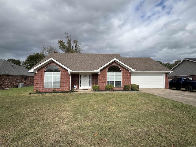 single story home featuring a garage and a front yard