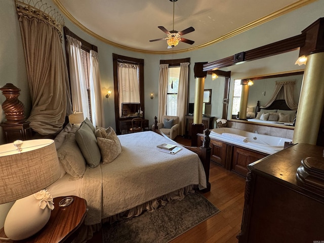 bedroom featuring ceiling fan, dark wood-type flooring, and ornamental molding