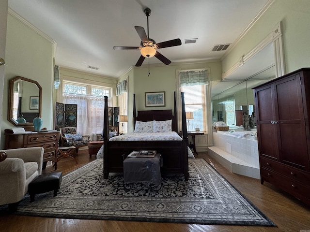 bedroom featuring ceiling fan, crown molding, and dark hardwood / wood-style floors