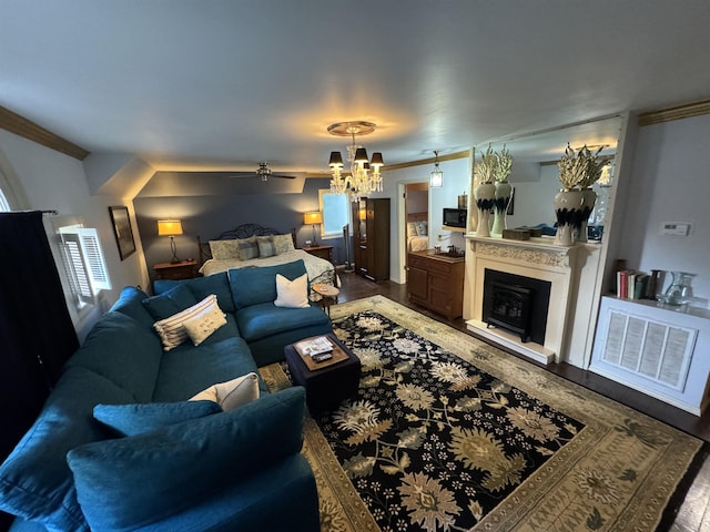 living room featuring hardwood / wood-style floors, ceiling fan with notable chandelier, and crown molding