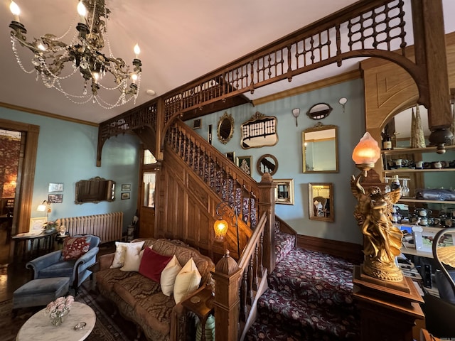 stairway with carpet floors, an inviting chandelier, and ornamental molding