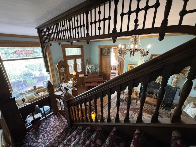 stairway with an inviting chandelier