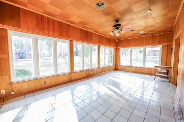 unfurnished sunroom with ceiling fan and wood ceiling