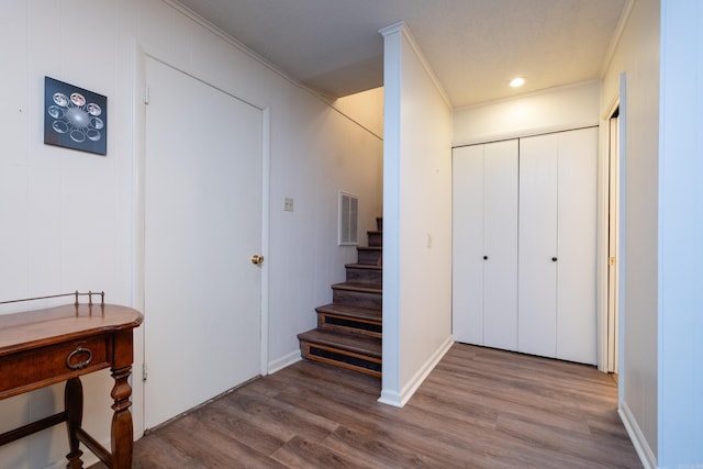 interior space with crown molding and hardwood / wood-style floors