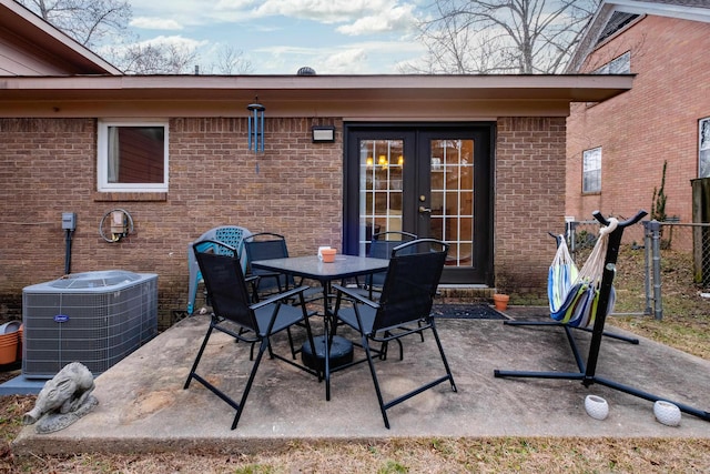 view of patio / terrace featuring french doors and cooling unit