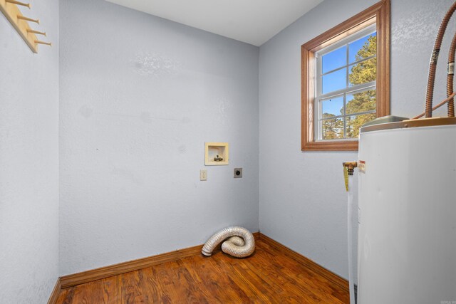 laundry area featuring washer hookup, electric dryer hookup, gas water heater, and wood-type flooring