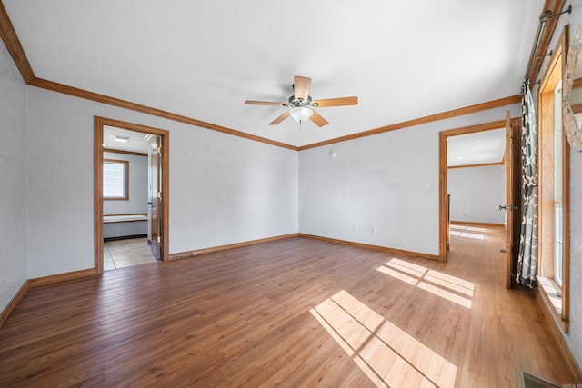 unfurnished room featuring crown molding, light hardwood / wood-style flooring, and ceiling fan