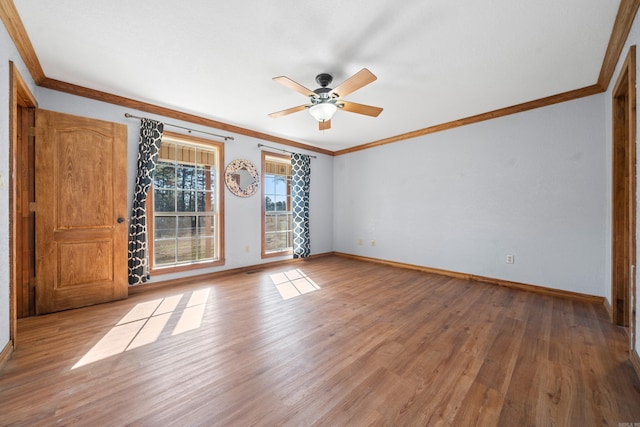 empty room featuring ceiling fan, light hardwood / wood-style flooring, and ornamental molding