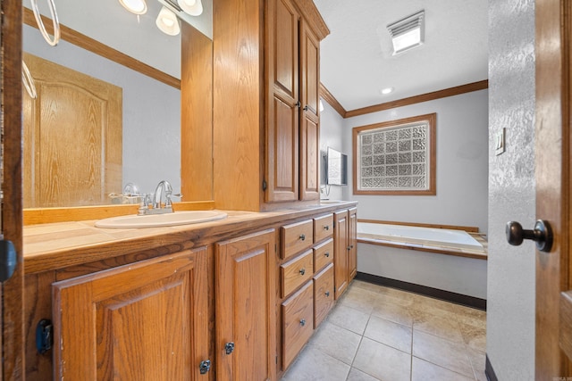 bathroom with a washtub, vanity, crown molding, and tile patterned flooring