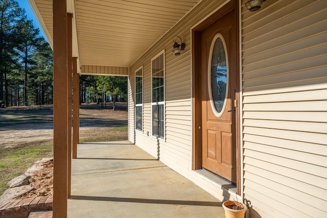 doorway to property featuring covered porch