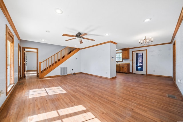 unfurnished living room with light hardwood / wood-style floors, ceiling fan with notable chandelier, and ornamental molding