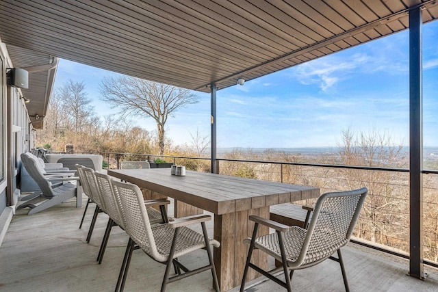 view of patio / terrace featuring a balcony and exterior bar