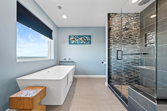 bathroom with shower with separate bathtub