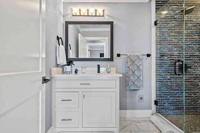 bathroom with vanity and a shower with door