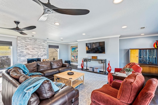 living room featuring a fireplace and ornamental molding