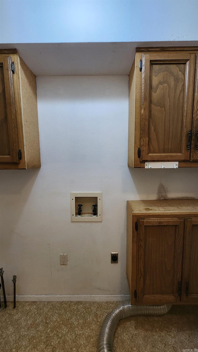 washroom with hookup for an electric dryer, cabinets, and washer hookup