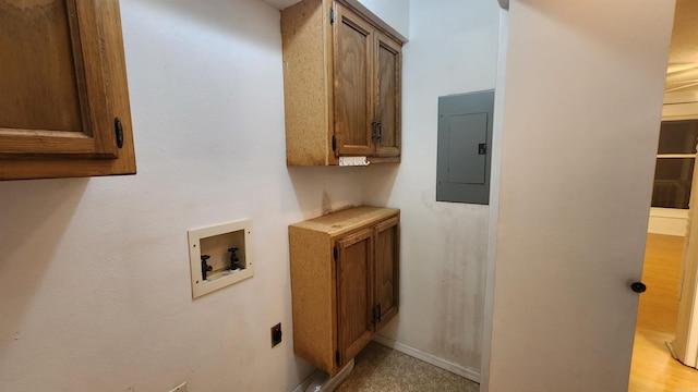 laundry room with hookup for an electric dryer, hookup for a washing machine, cabinets, and electric panel