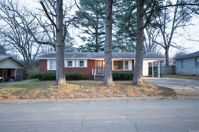 ranch-style house featuring a carport