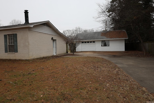 view of side of property featuring a garage