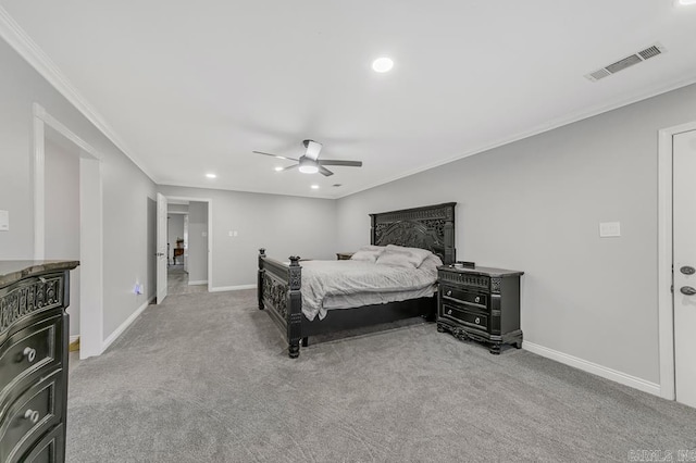 carpeted bedroom featuring ceiling fan and ornamental molding