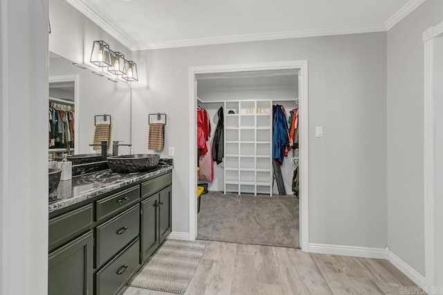 bathroom featuring vanity and ornamental molding