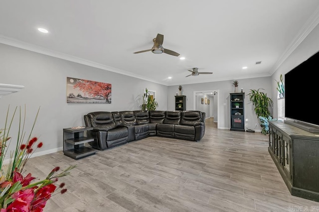 living room featuring ceiling fan, crown molding, and light hardwood / wood-style flooring